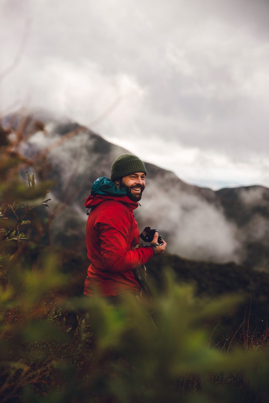Adam Reynolds in the mountains, camera in hand